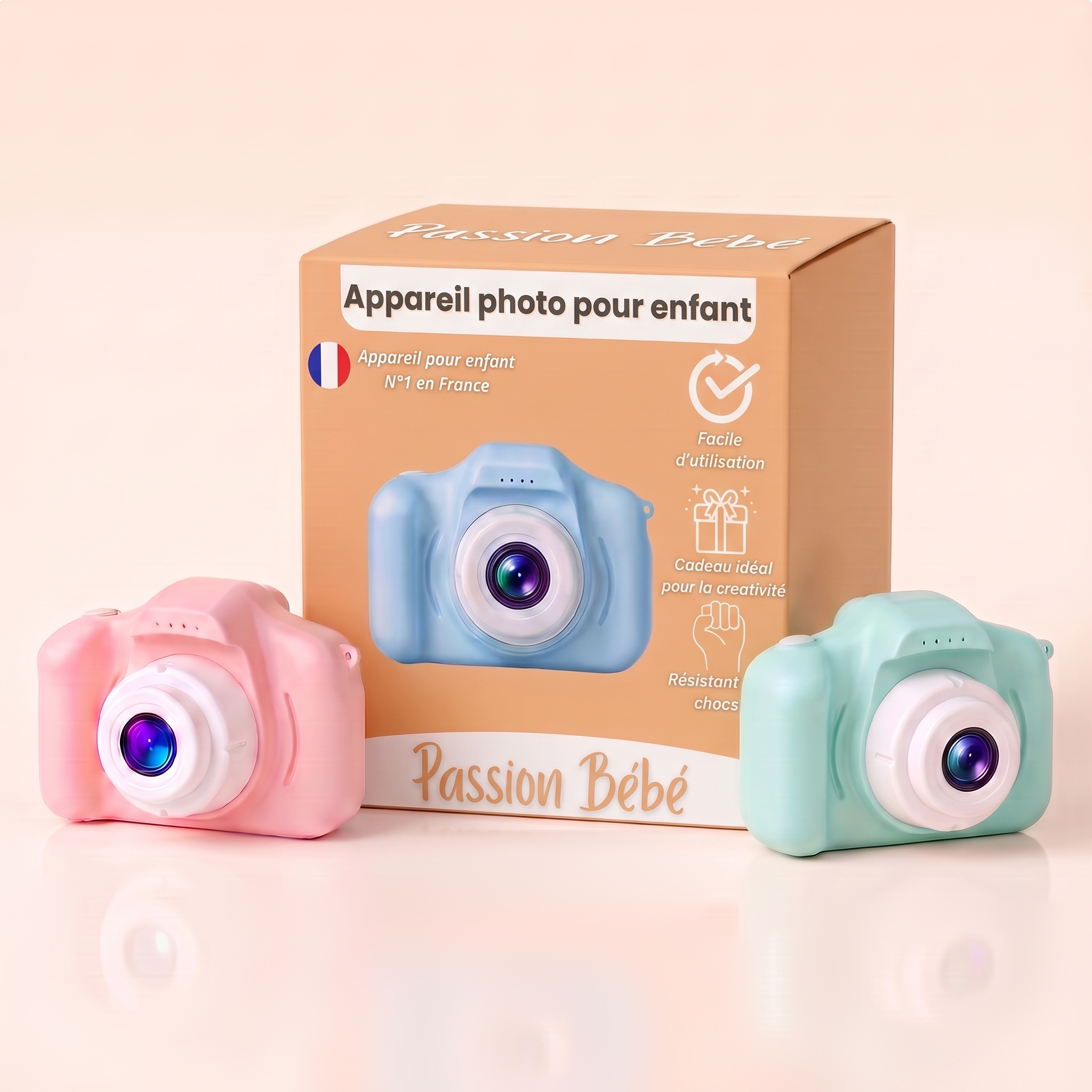 Appareil photo pour enfant Passion Bébé et sa boîte, coloris rose, bleu et vert